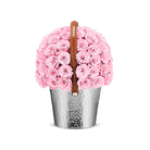 Basket filled with pink roses on a white background